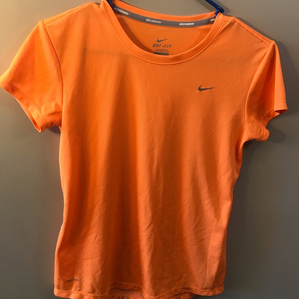 Woman’s Nike Dry-Fit Orange short sleeve shirt